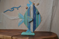 Bahr Stripe Fish swimming in clear water, vibrant striped pattern on its body, showcasing its colorful scales and fins.