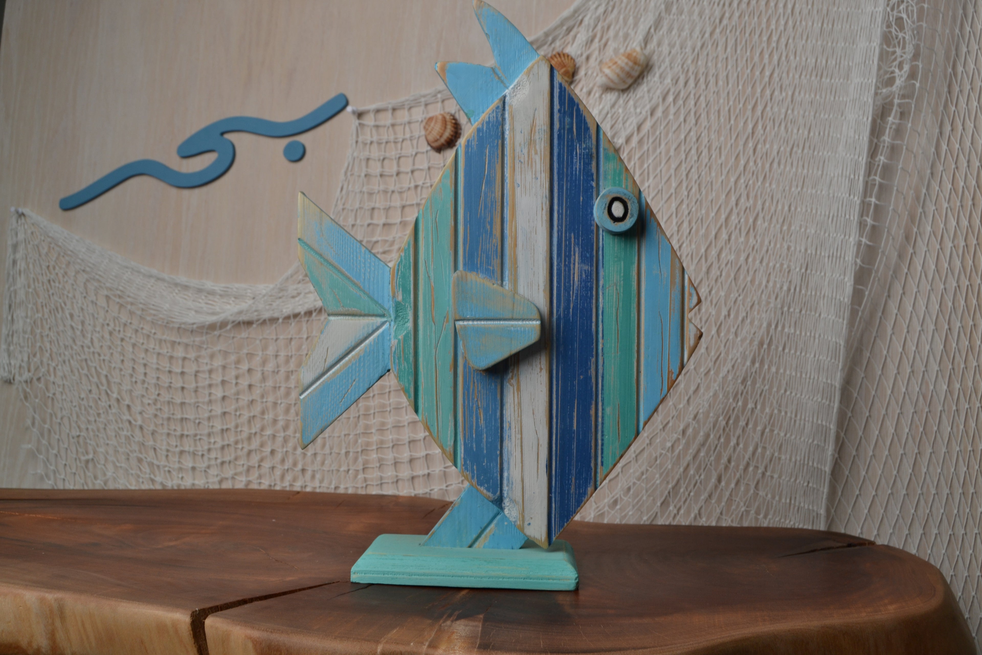 Bahr Stripe Fish swimming in clear water, vibrant striped pattern on its body, showcasing its colorful scales and fins.